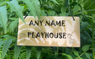 The engraved acrylic sign for a child's playroom, featuring a cute lion and giraffe design with a personalized name.
