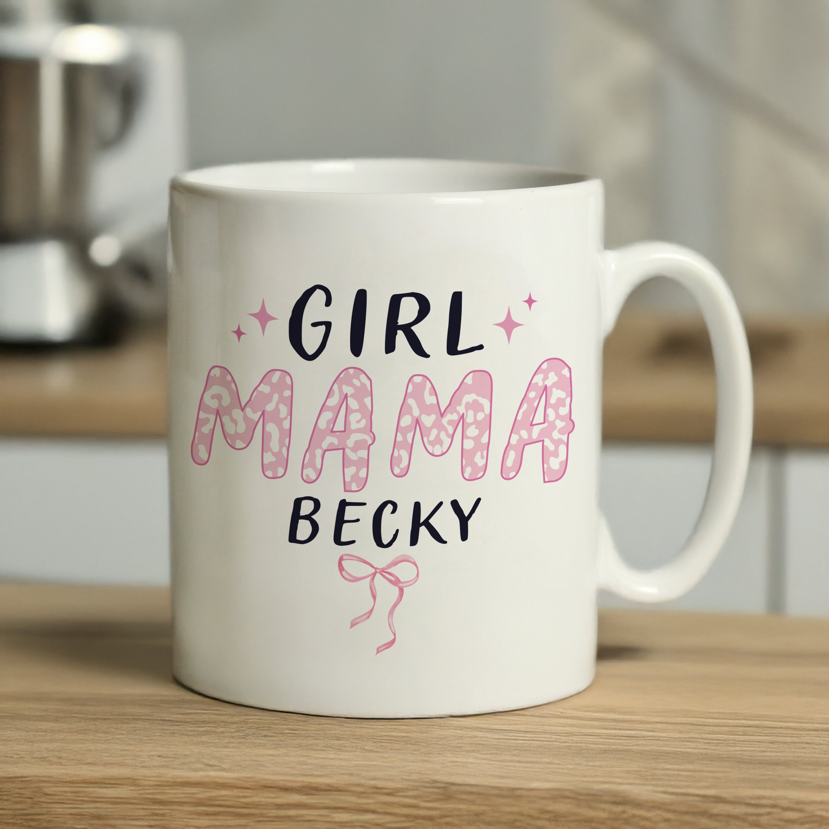 White mug with 'Girl Mama Becky' text on a wooden surface