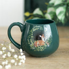 Green ceramic mug with fawn and bunny design