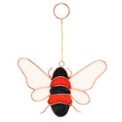 Hanging bee suncatcher with vibrant colors reflecting sunlight.