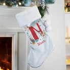 Luxury velvet Christmas stocking with soft white plush cuff material detail.

