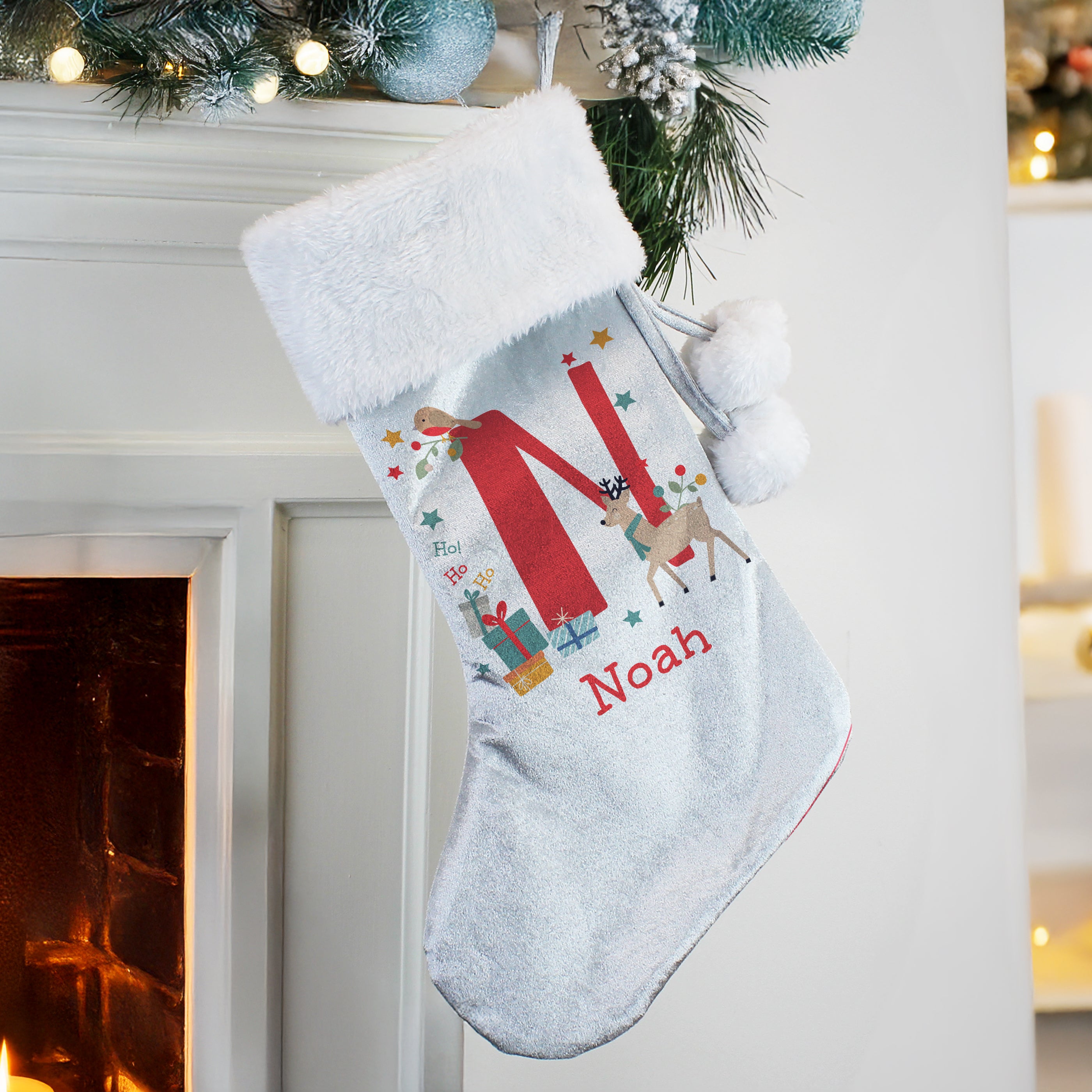 Luxury velvet Christmas stocking with soft white plush cuff material detail.
