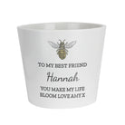 White ceramic pot with bee design and personalized text on a white background