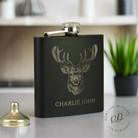 Elegant black stainless steel hip flask with custom engraving.