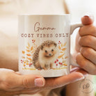 Personalised ceramic coffee mug featuring autumn hedgehog illustration, unique gift for wildlife enthusiasts
