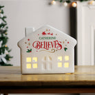 Full view of the personalised ceramic LED light-up house Christmas decoration.

