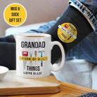 White mug with 'Grandad Fixer of All Things' text, black sock with yellow label, and 'Mug & Sock Gift Set' label.