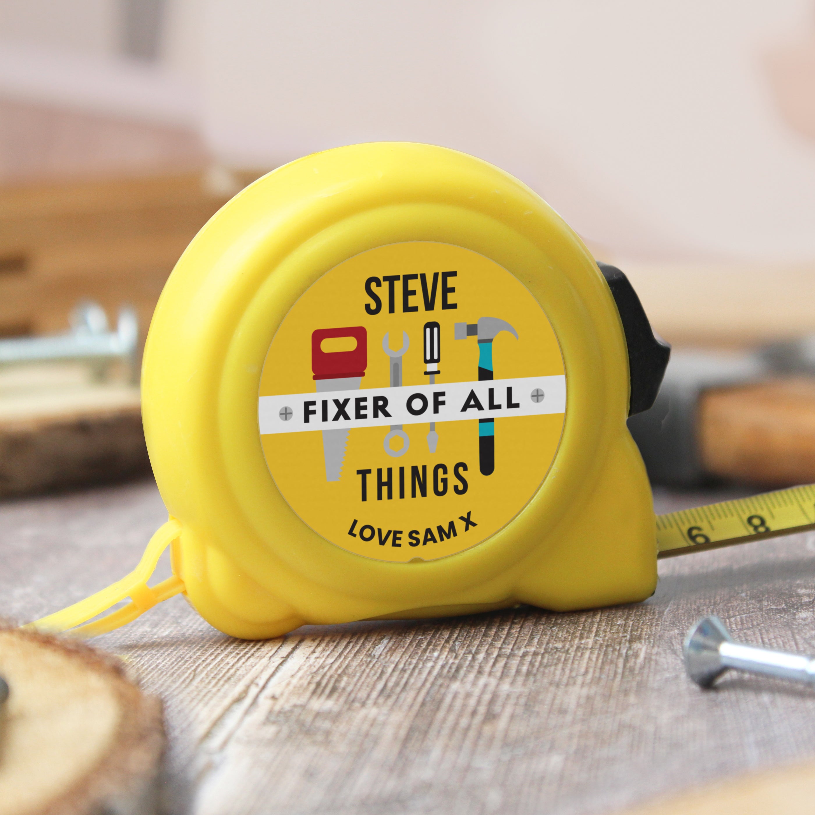 Yellow personalised Fixer of All Things tape measure with custom name and message