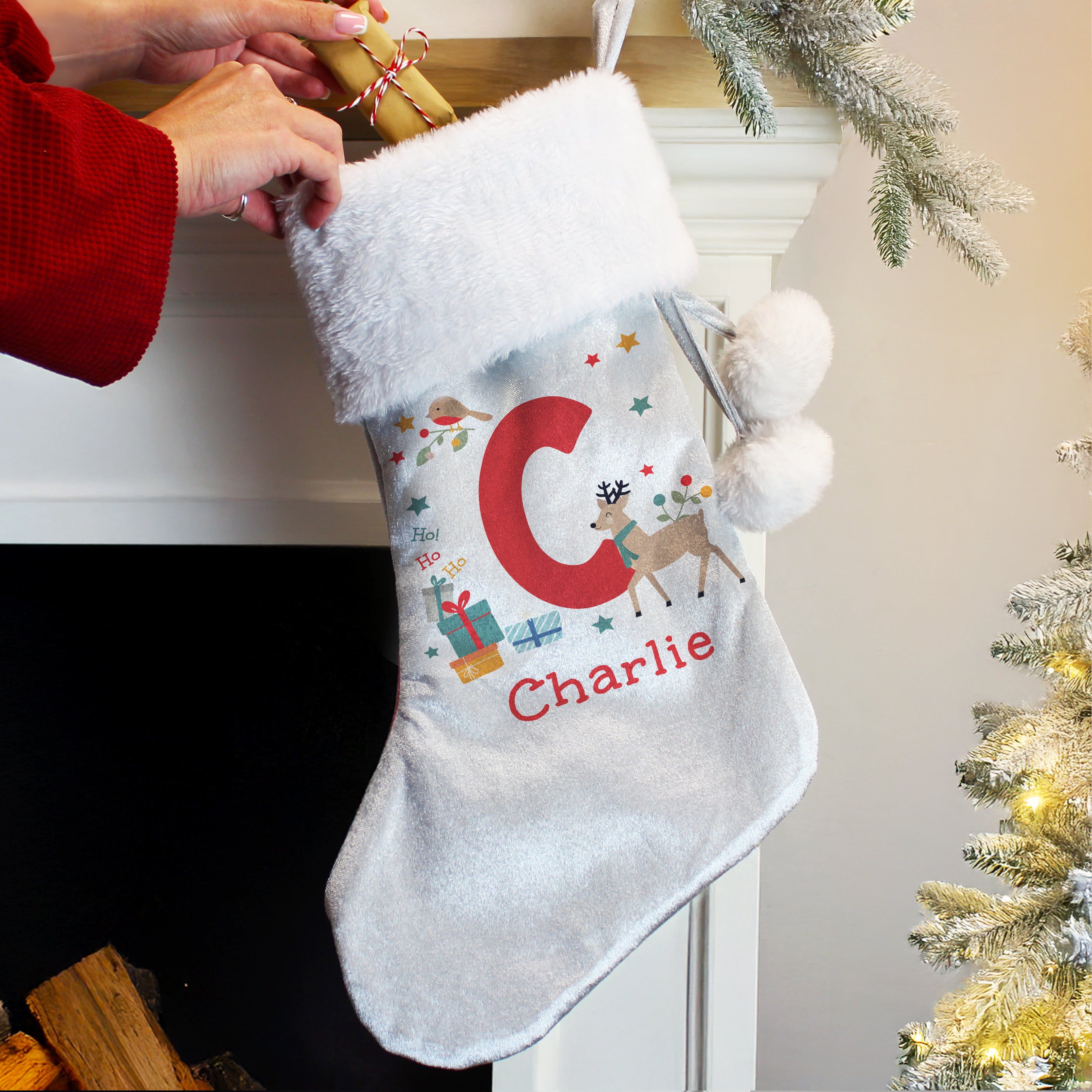 Full view of personalised velvet initial reindeer Christmas stocking.