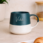 Personalised blue speckled ceramic mug with custom name on a two-tone design