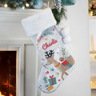 Full view of the personalised reindeer velvet Christmas stocking with white cuff.
