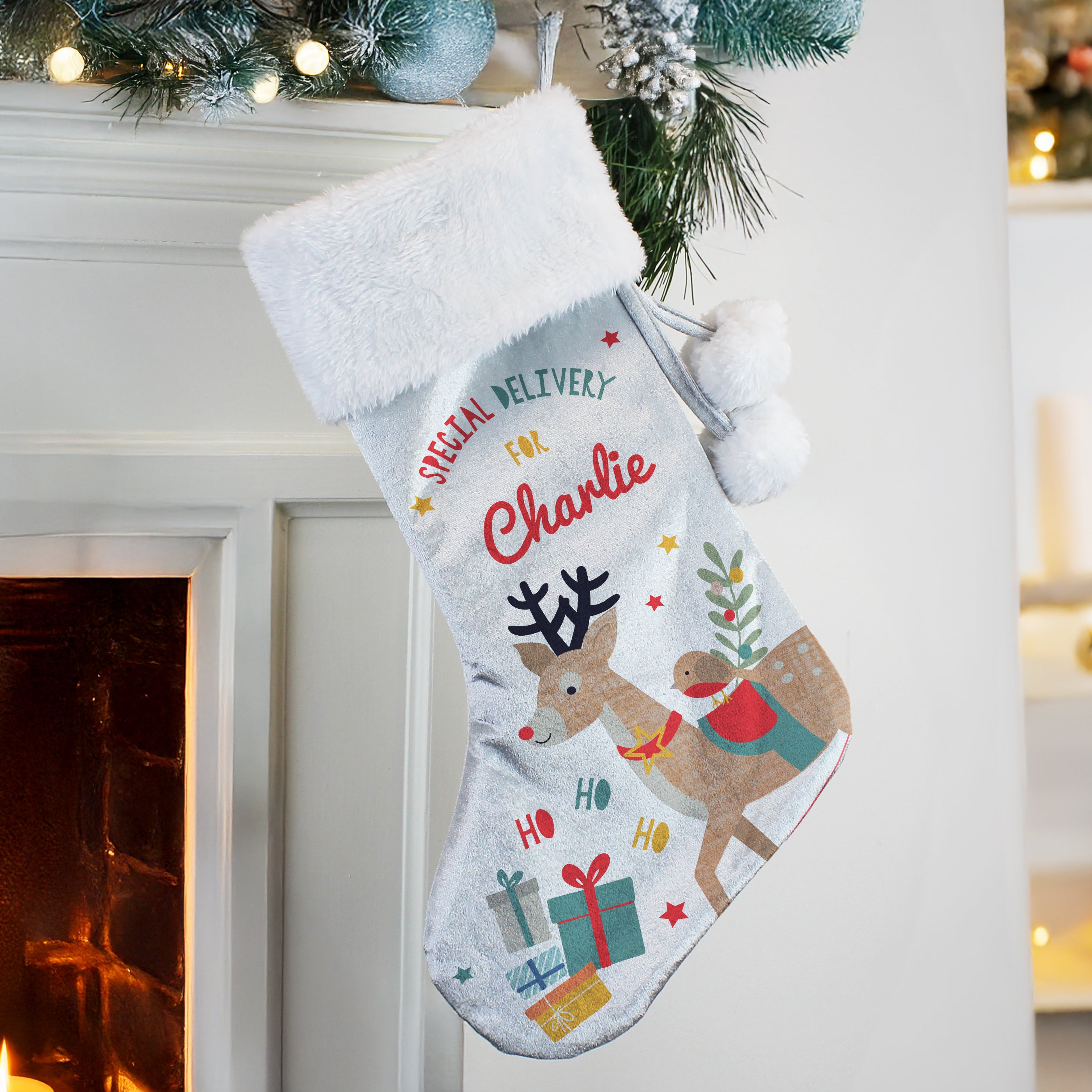 Full view of the personalised reindeer velvet Christmas stocking with white cuff.
