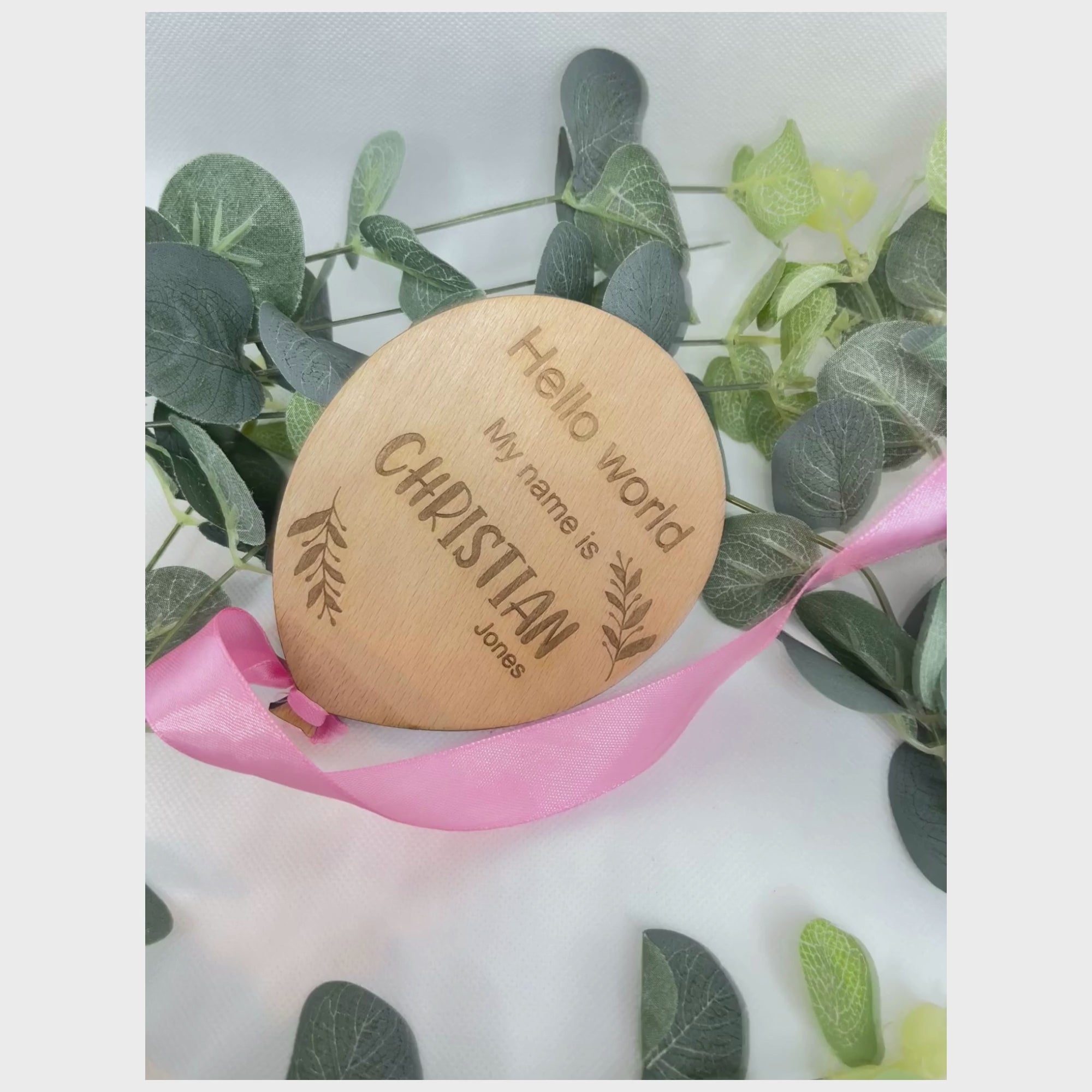  personalised baby announcement plaque with a pink ribbon