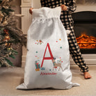 Close-up of the initial and reindeer design on the front of the festive Christmas sack.
