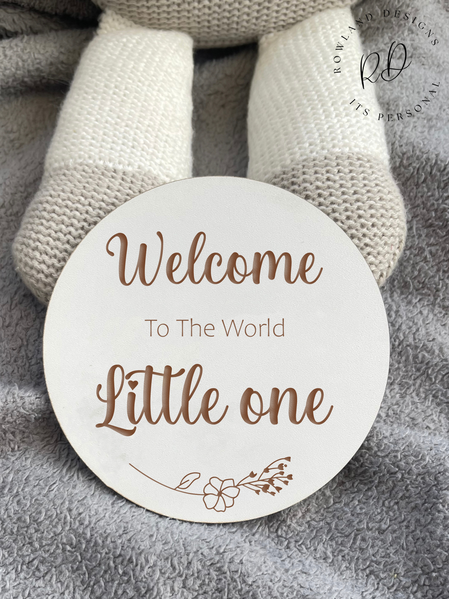 Personalised baby name announcement plaque in clean white MDF with engraved floral details.