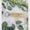 Make a toast to friendship and memorable moments with our Personalised Wedding Bottle Openers. Each piece, laser-engraved with a fun hat image, commemorates your special day while serving as a useful keepsake. Crafted from durable stainless steel and wood, these openers are personalised with the recipient's name, their role in the wedding, and the date of the event. A lasting memento that's both stylish and functional. Please hand wash only. For personalisation, provide: name, role, and wedding date.