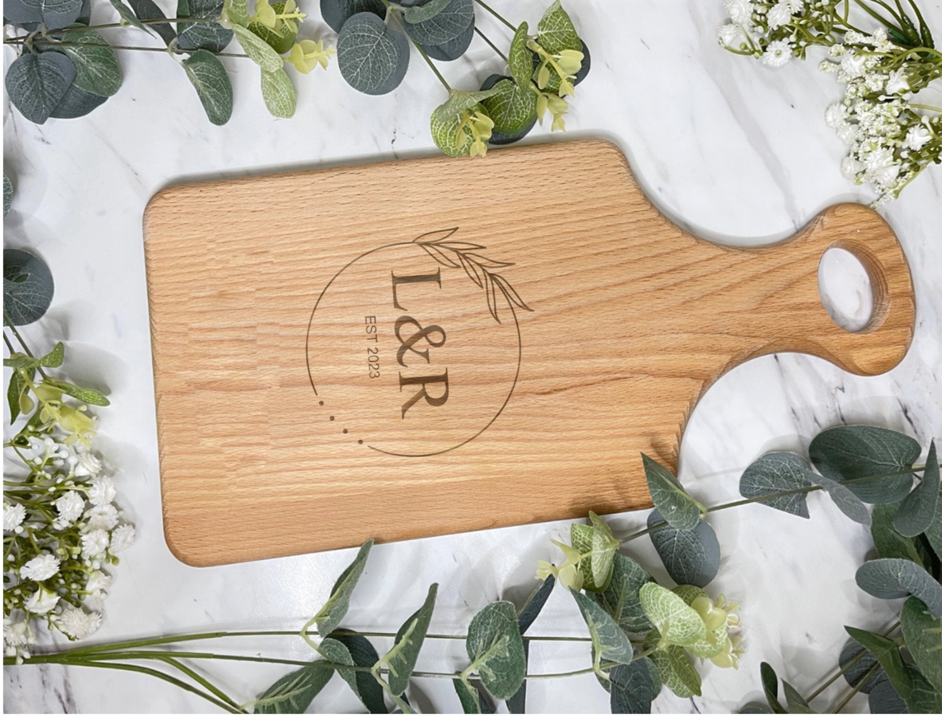Close-up of leaf engraving on chopping board