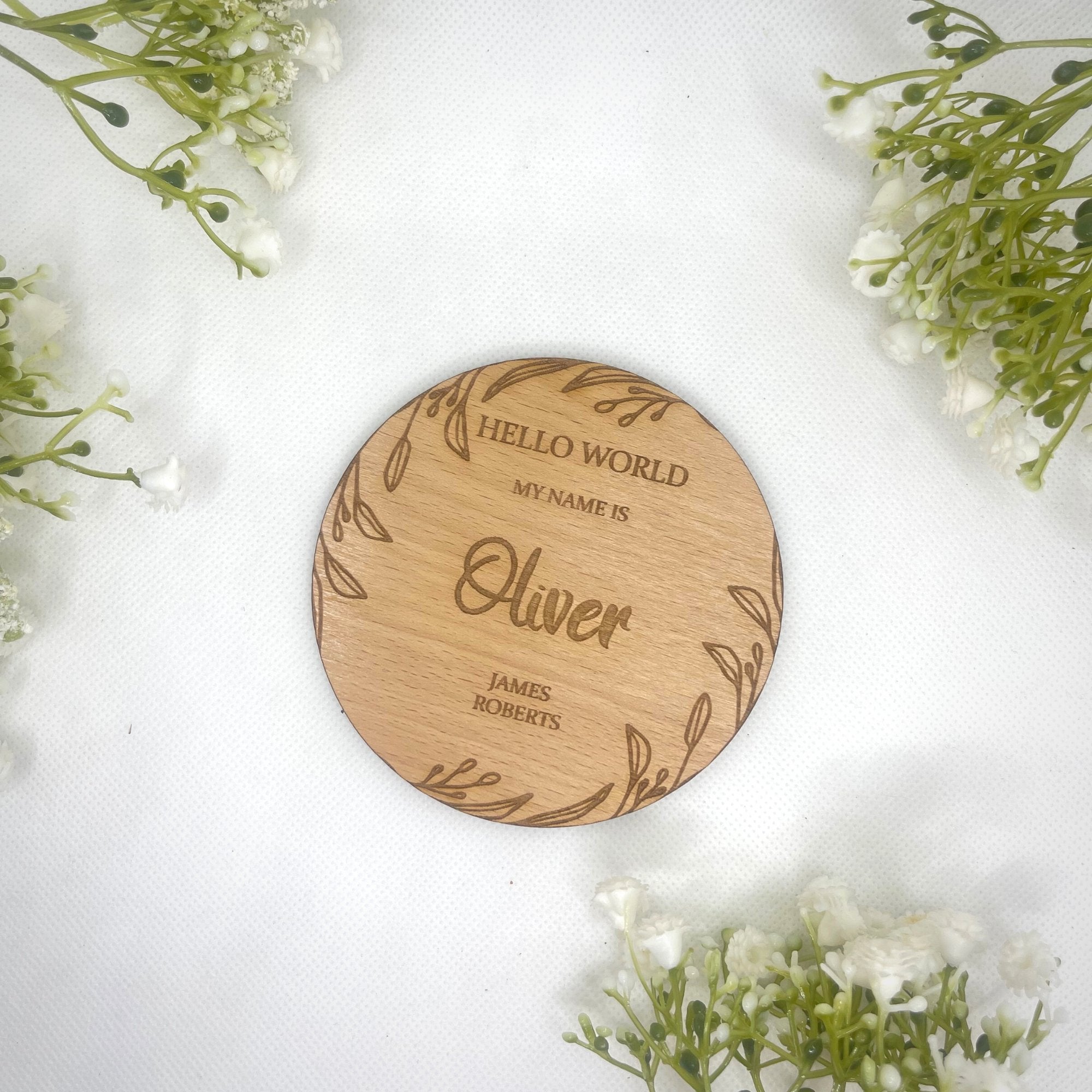 A personalised baby announcement plaque with a natural leaf design, perfect for a newborn keepsake.