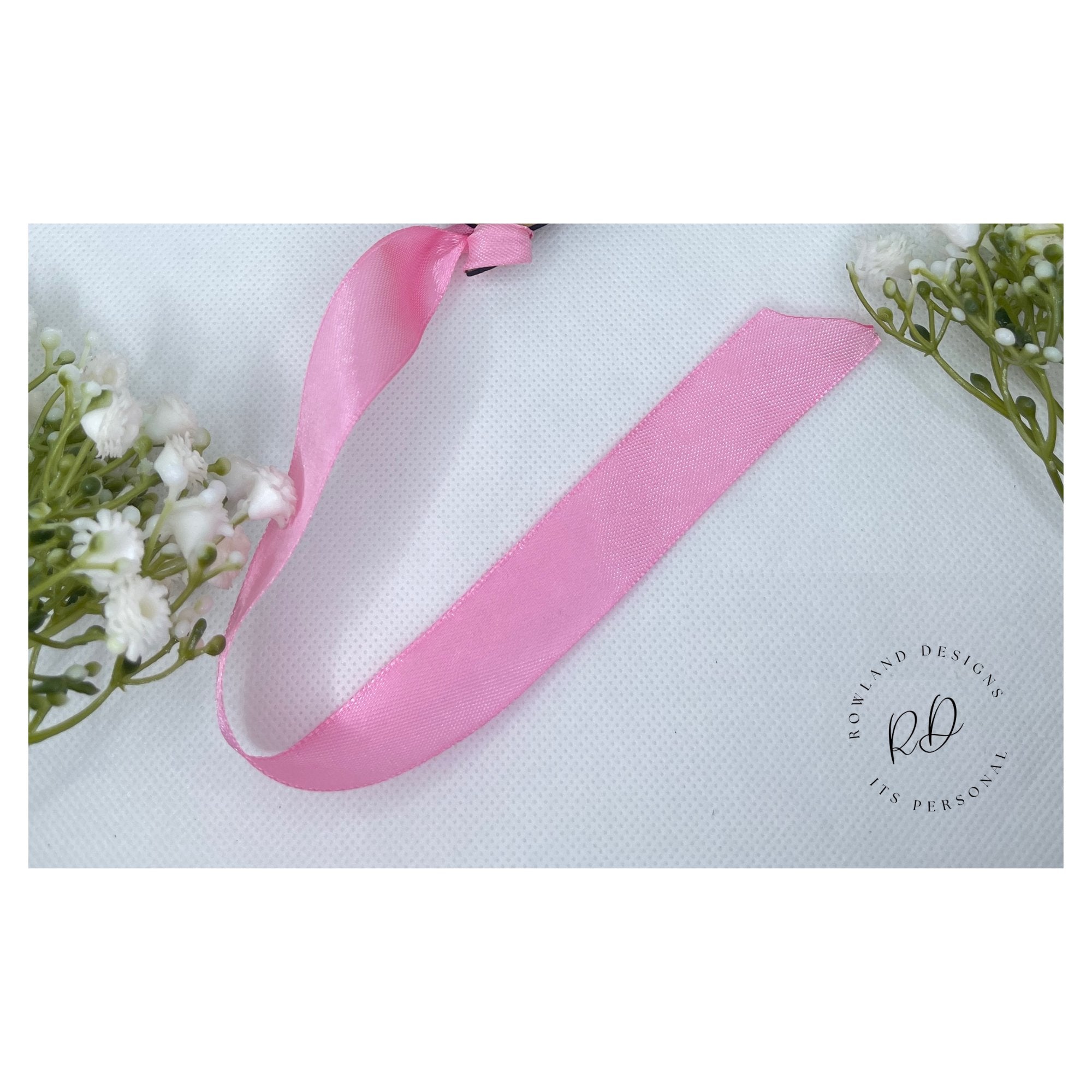 Pink ribbon for baby announcement 