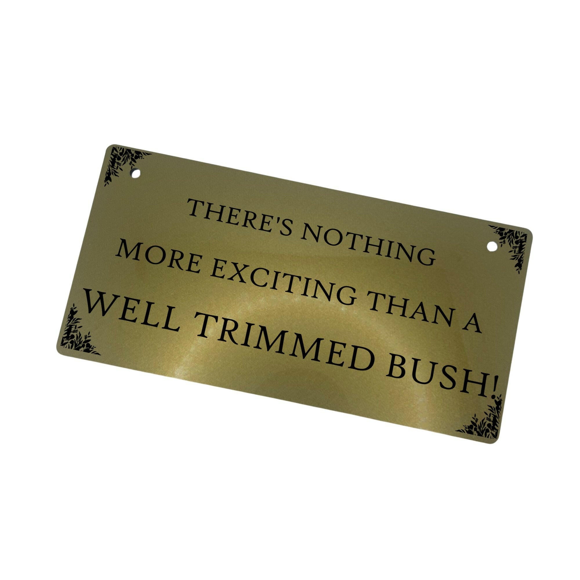The "Well Trimmed Bush" sign hanging - gold- white background 