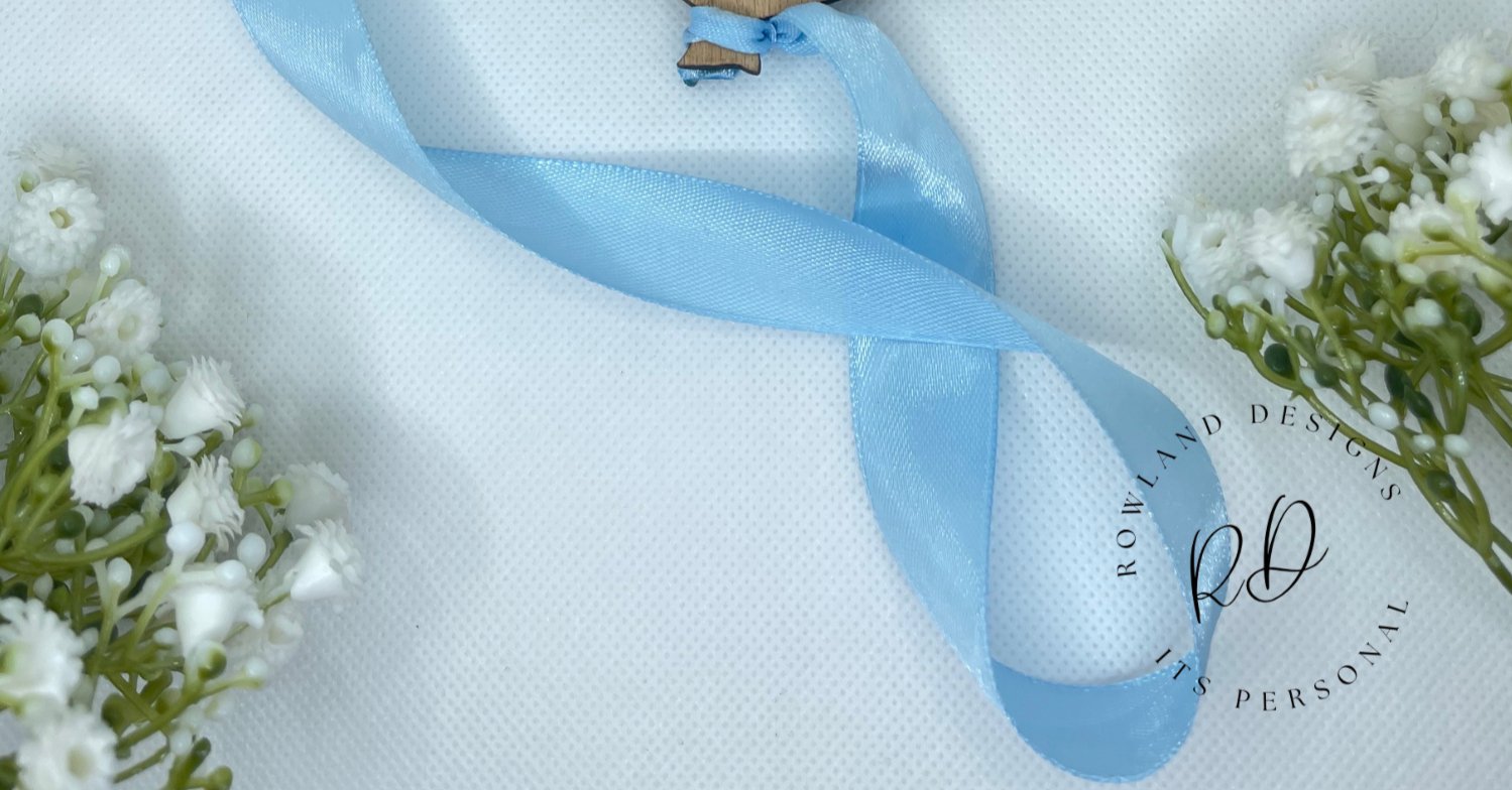 blue ribbon shown for balloon baby announcement 