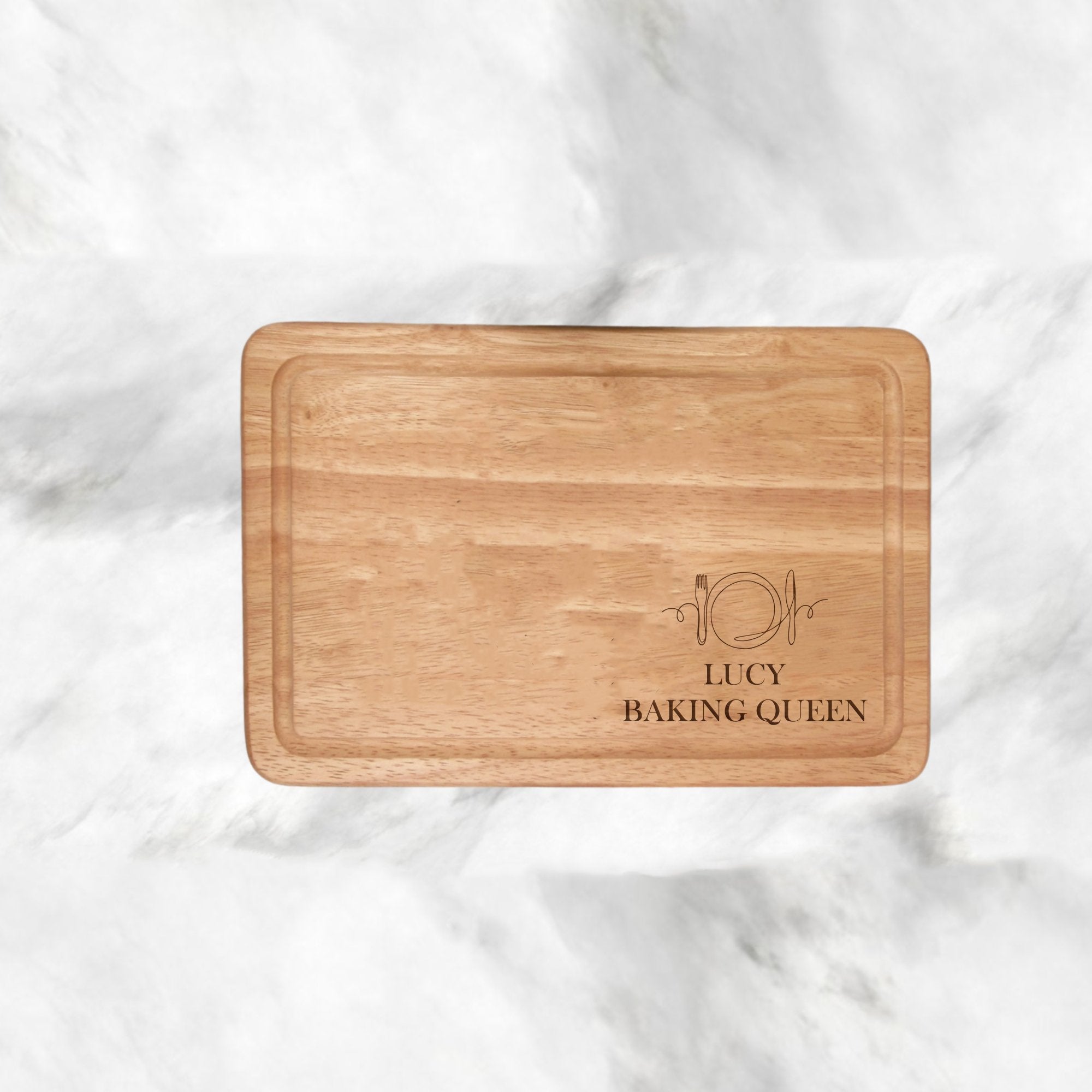 Elevate your kitchen or surprise a loved one with our uniquely personalised Personalised Chopping Board Knife & Fork Design. Engrave two lines of your own text (max 20 characters each in caps) on this robust, premium wood board, making it the perfect blend of style and sentiment. Ideal for housewarmings, weddings, or anniversaries, this board adds beauty and individuality to your cooking, providing a versatile and classy addition for day-to-day and special occasions. 